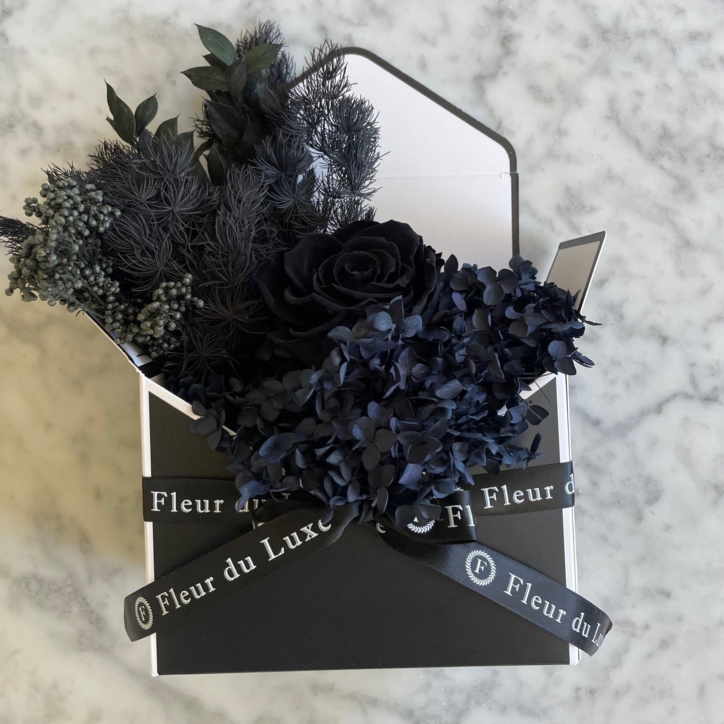 black everlasting roses in envelope 