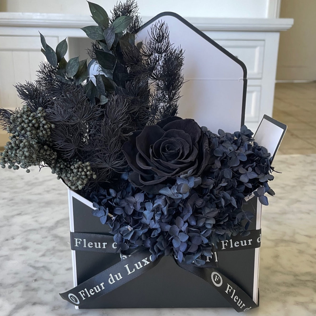 black everlasting roses in envelope 