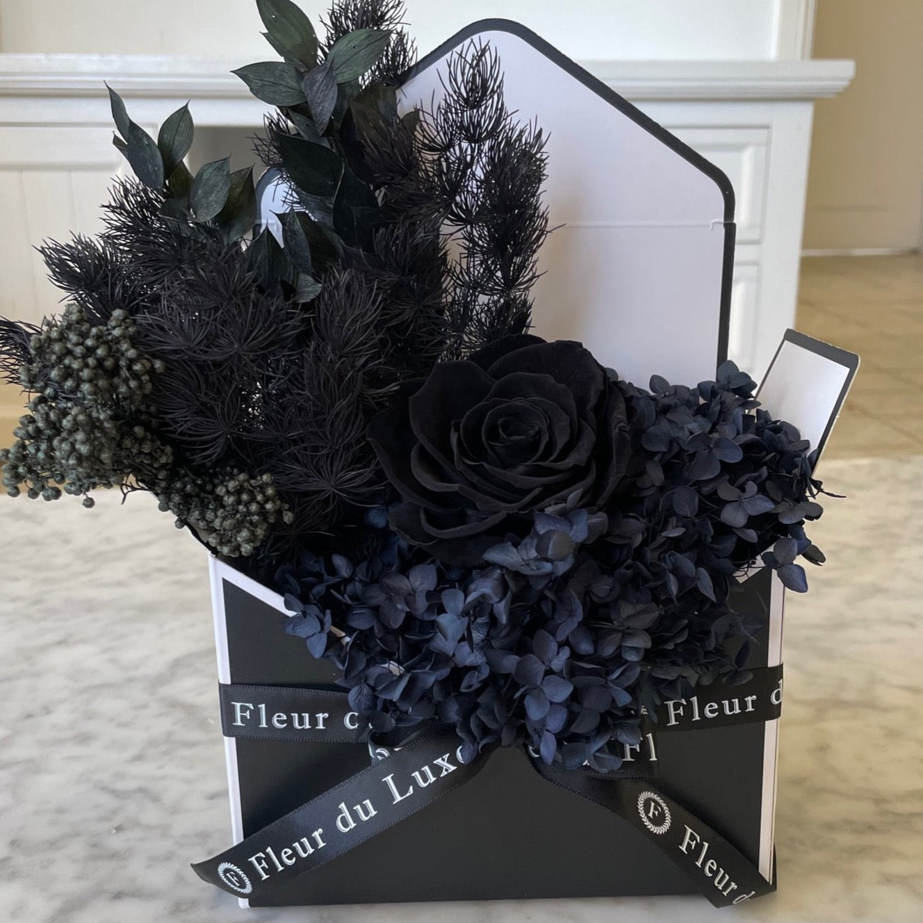 black everlasting roses in envelope 