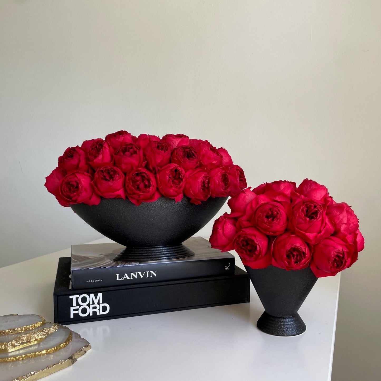 Red everlasting peonies in black pot