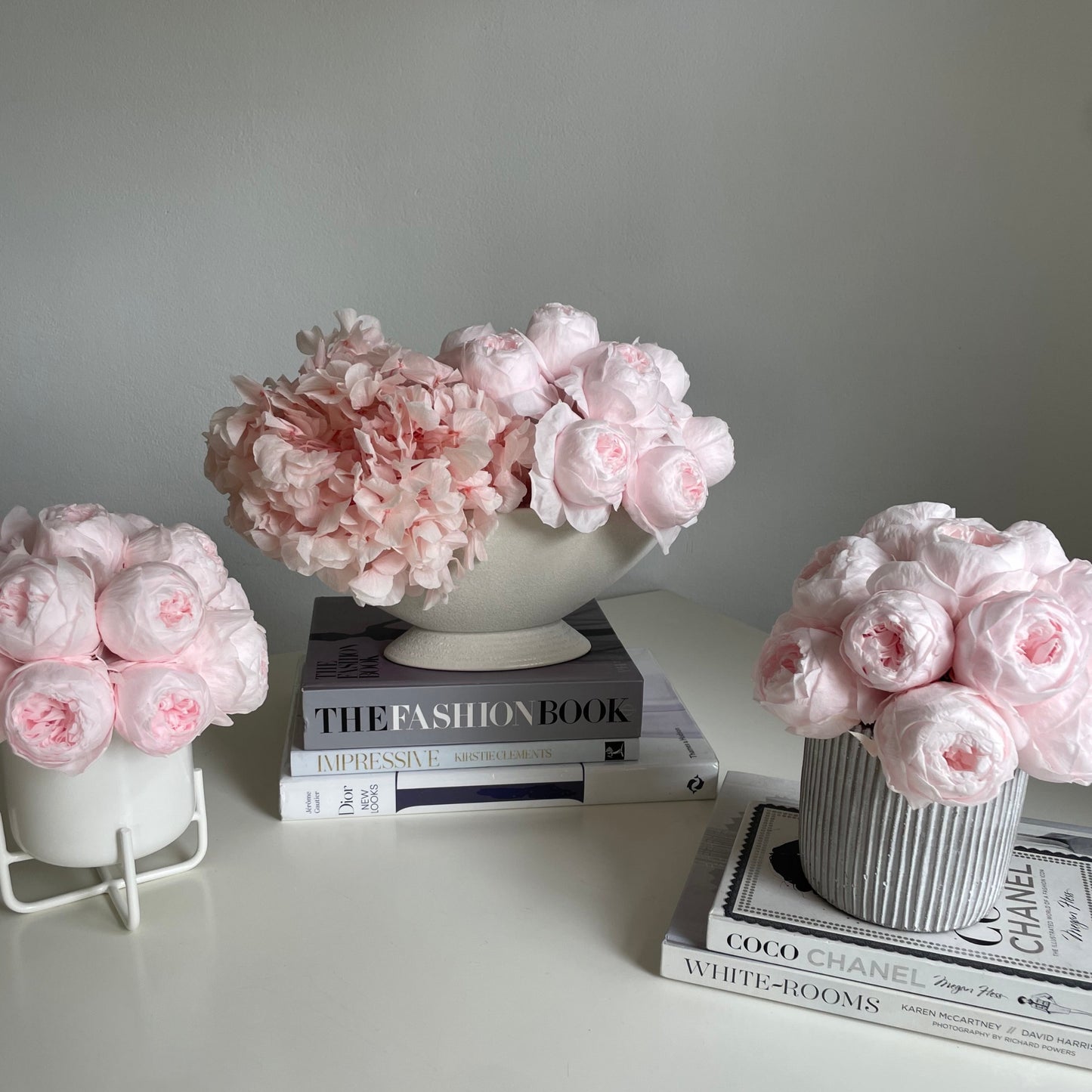 Everlasting pink peonies in white pot