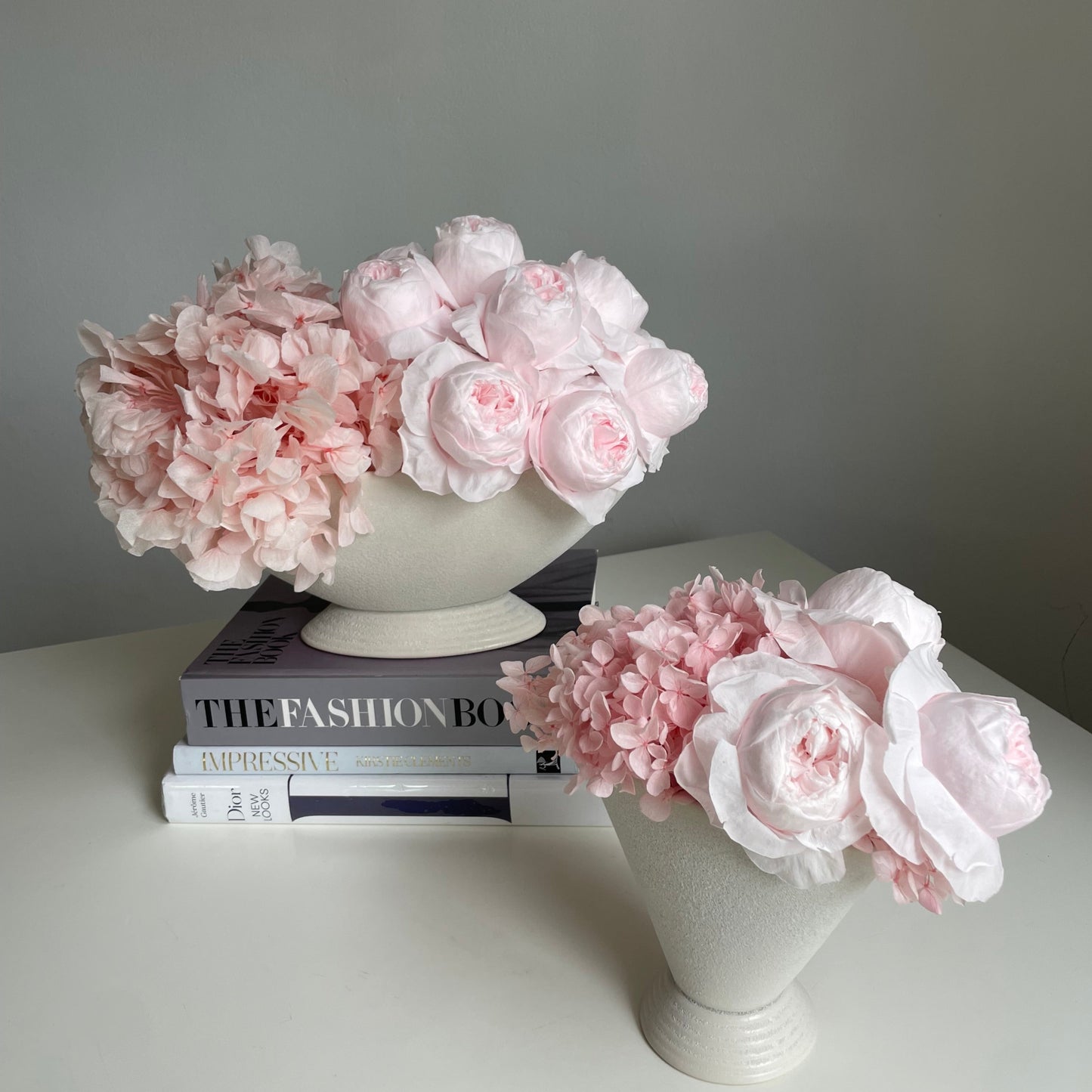 Everlasting pink peonies in white pot