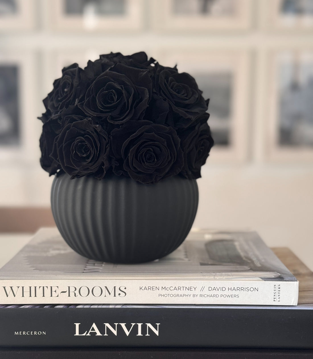 Elegant black ribbed pot with preserved black roses from Fleur du Luxe