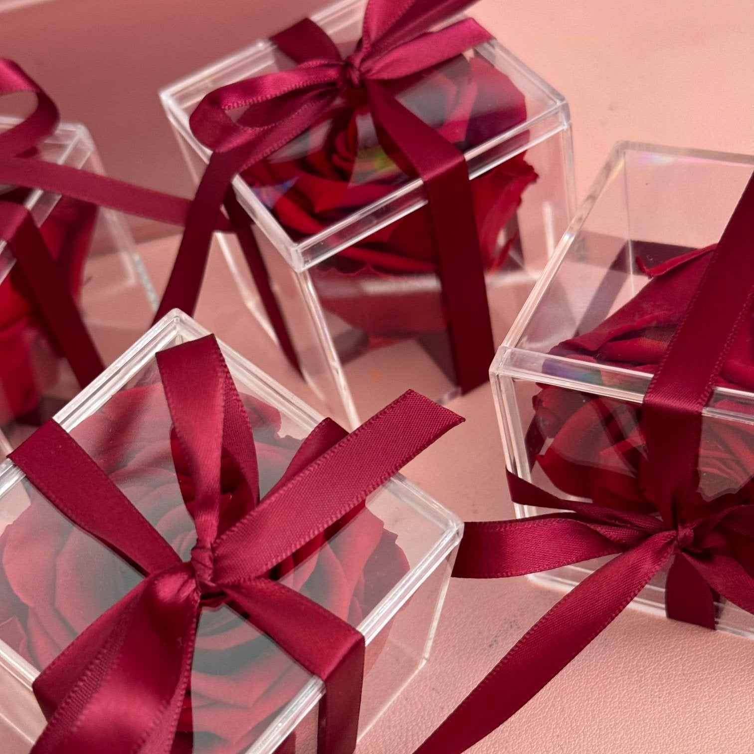 "Luxurious preserved rose encased in a crystal-clear acrylic box, an elegant and thoughtful Christmas gift."