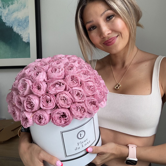 : A top-down perspective of the round box filled with preserved peonies, displaying the symmetrical and luxurious floral arrangement.