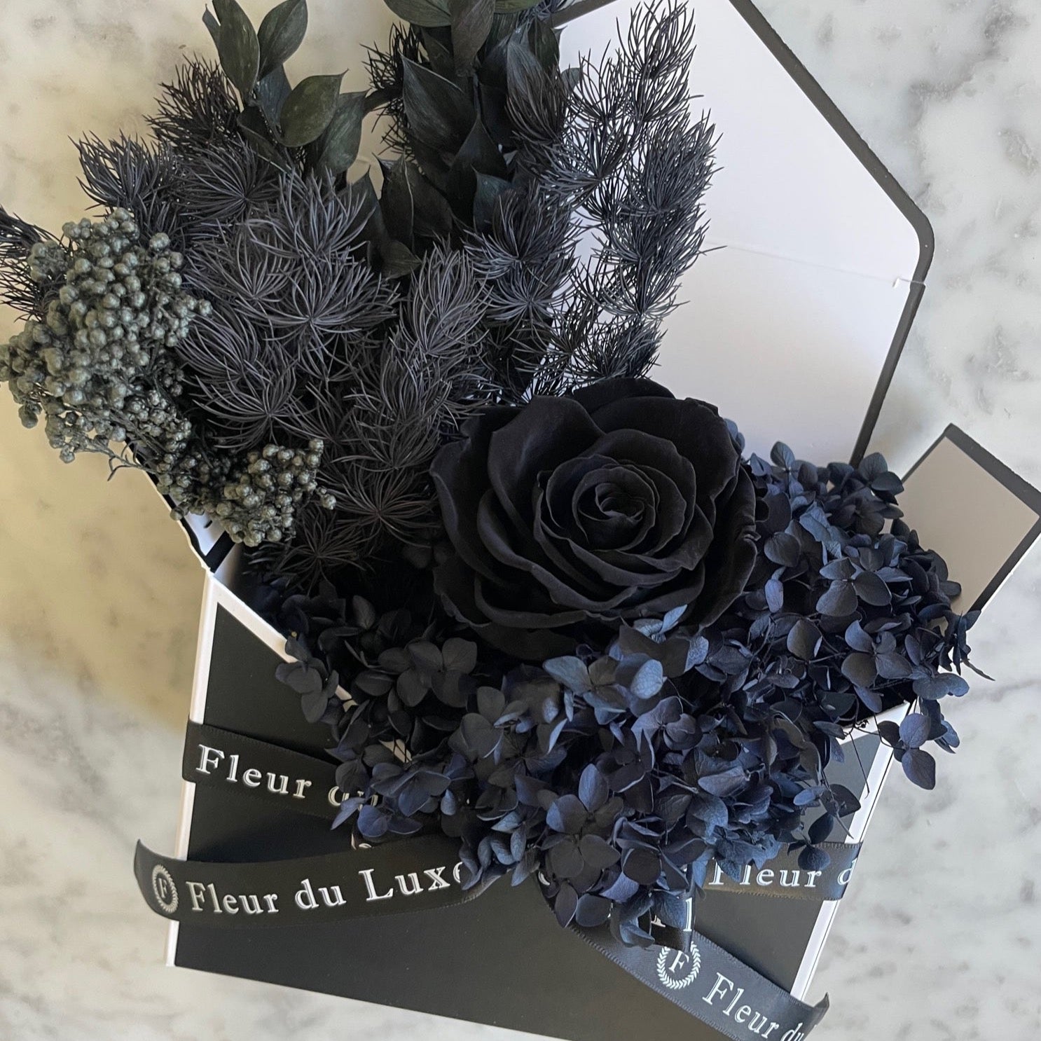 black everlasting roses in envelope 