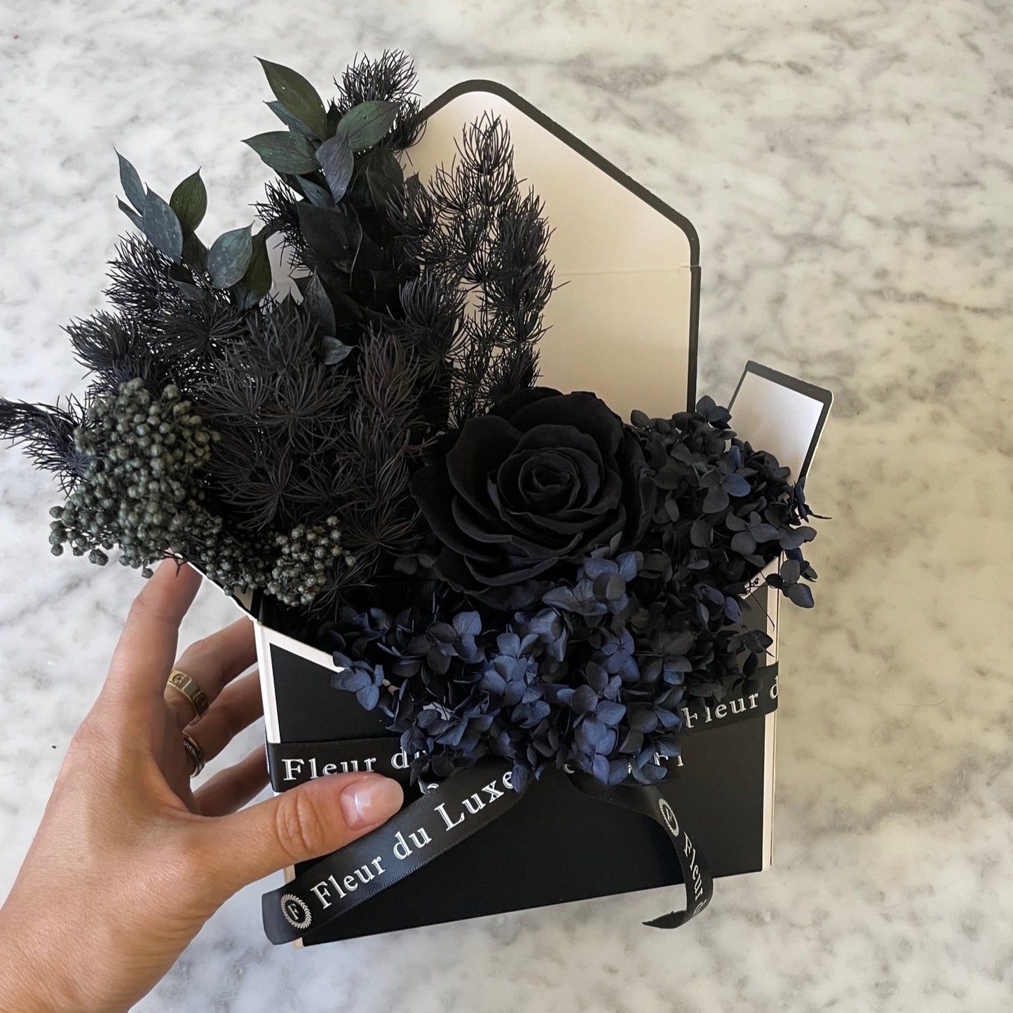 black everlasting roses in envelope 