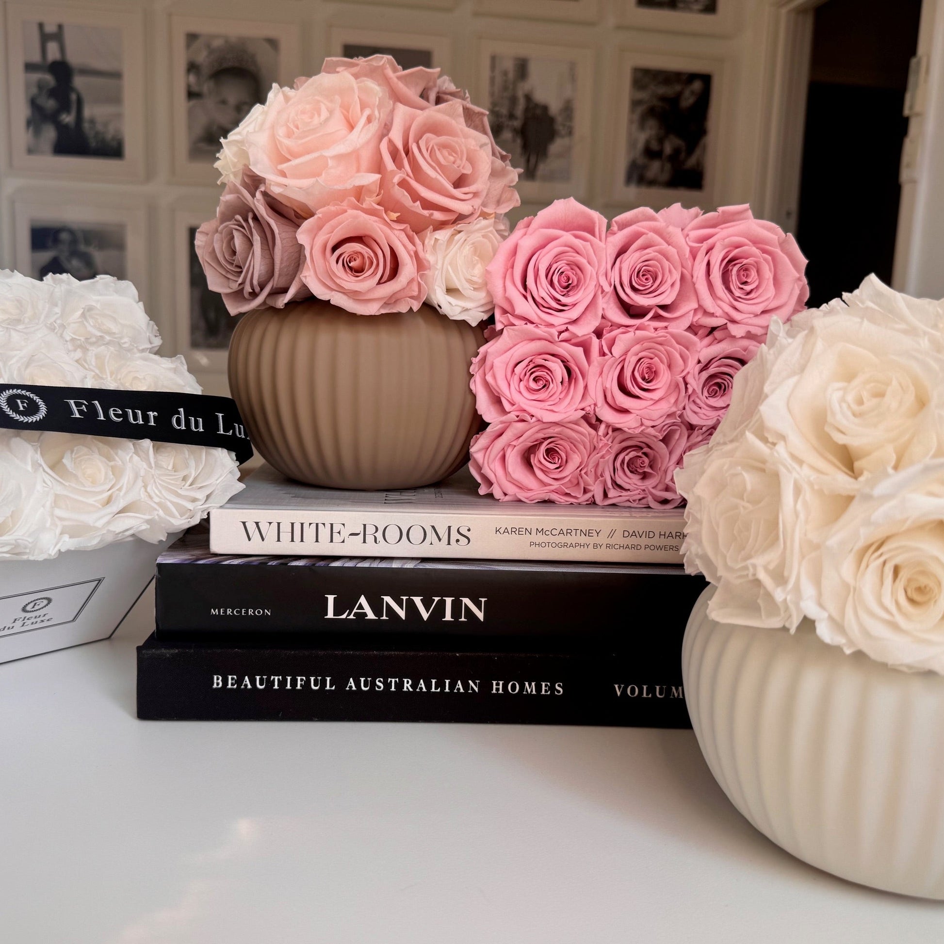 "Sophisticated Ribbed Sand-Colored Pot with cream-colored roses, perfect as a dining table centerpiece