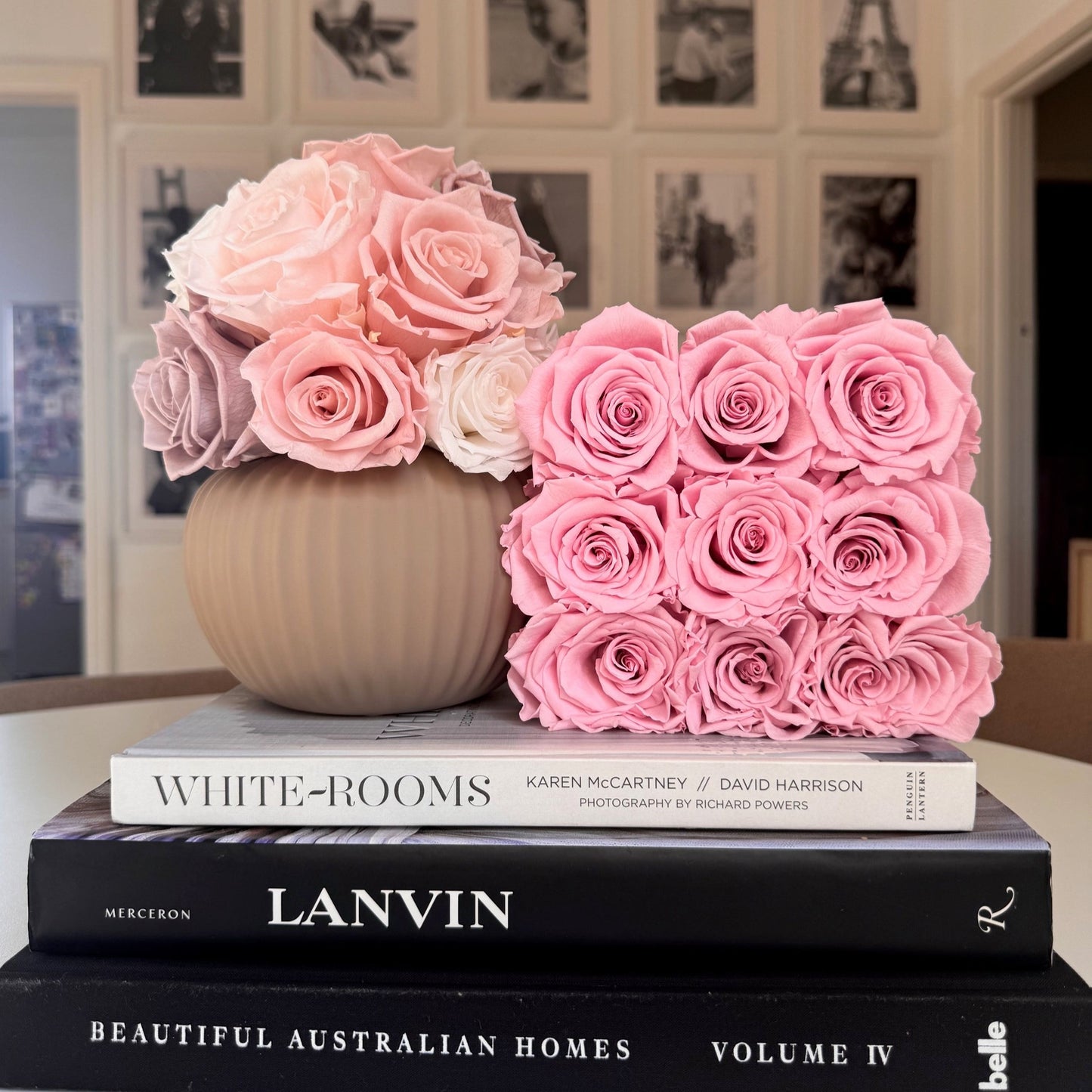 Ribbed Sand-Colored Pot with cream-colored roses adding a touch of opulence to a bookshelf display