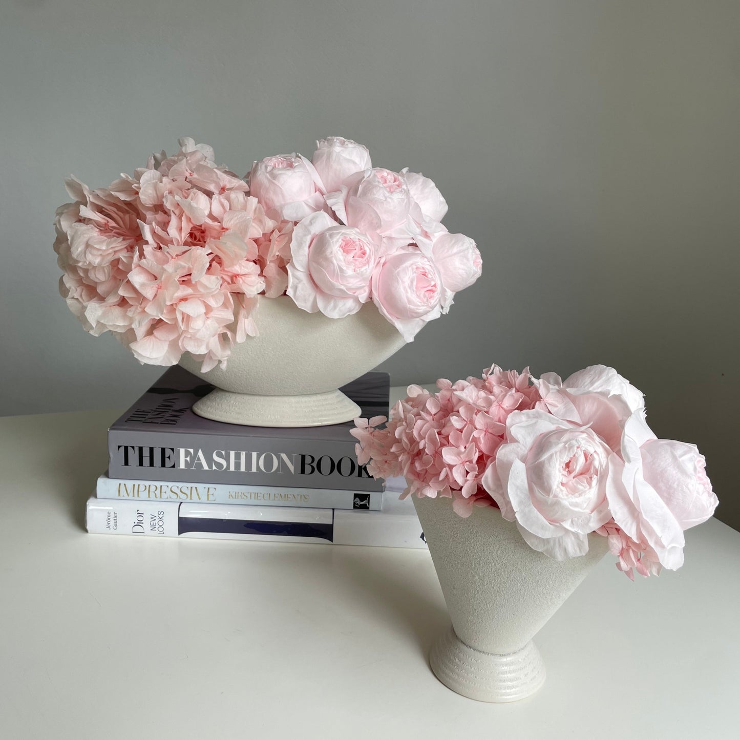Everlasting pink peonies in white pot
