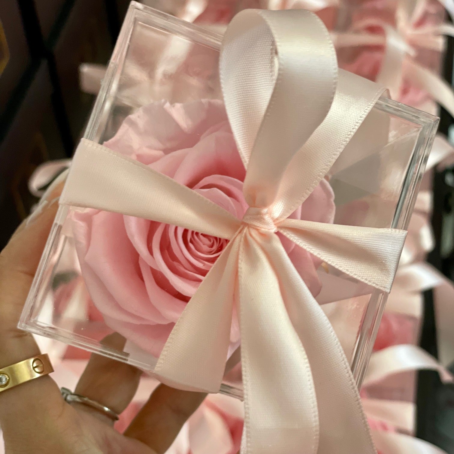 "Stylish preserved rose in a modern clear acrylic box, ideal for décor or gifting on special occasions."