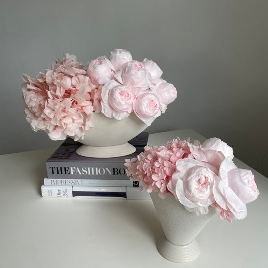 Everlasting pink peonies in white pot